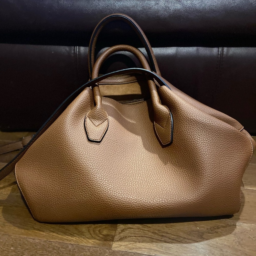 Brown purse with lots of pocket space and room